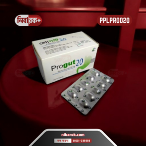 Close-up image of Progut 20 capsules alongside a glass of water on a reflective surface.